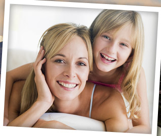 woman and girl smiling